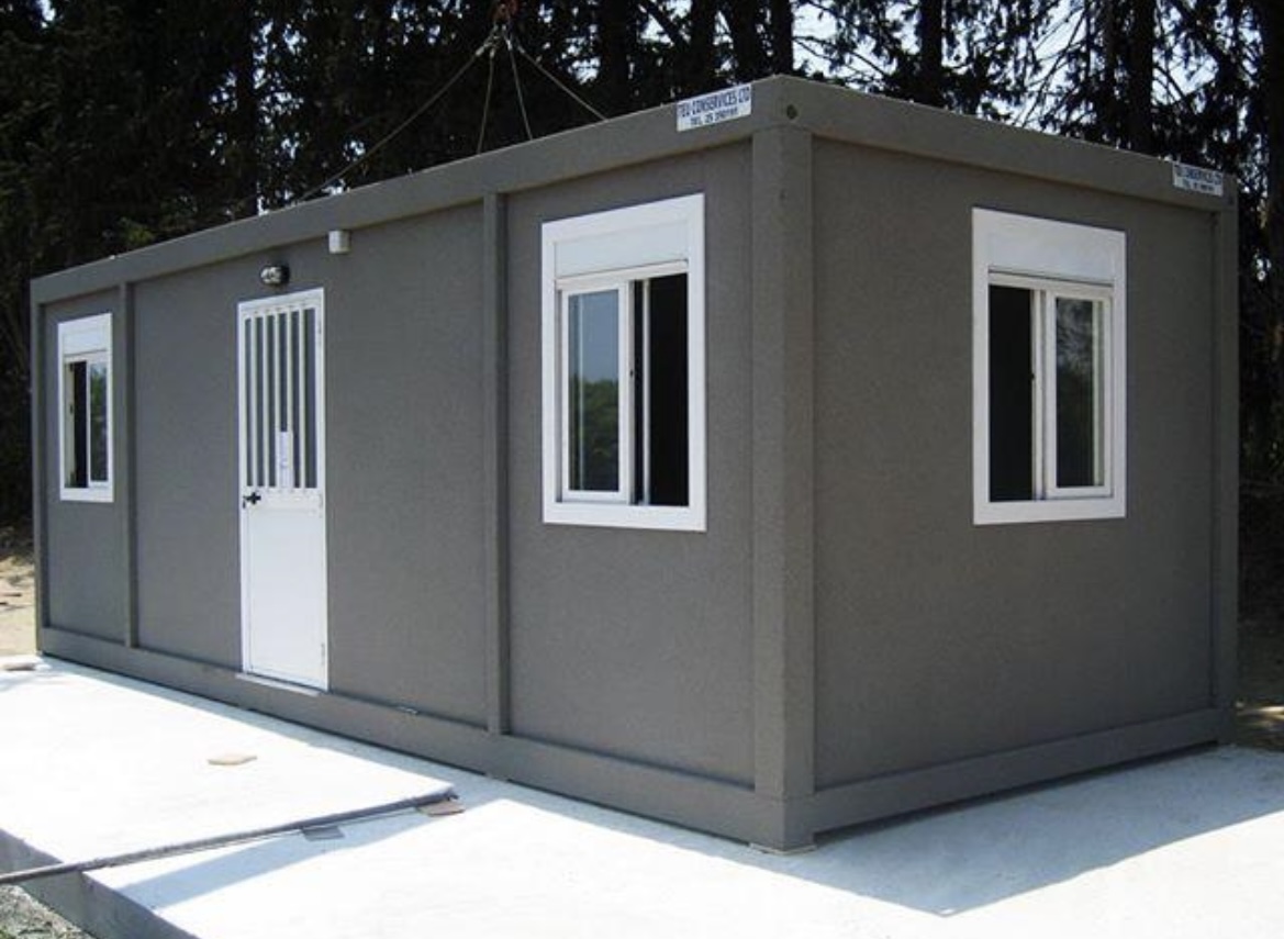 Modular site cabin finished in grey spray cork